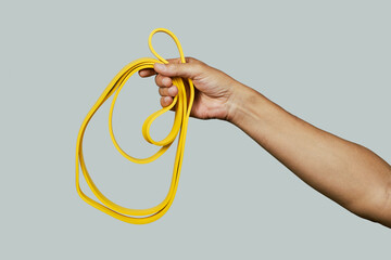 man with a yellow resistance band