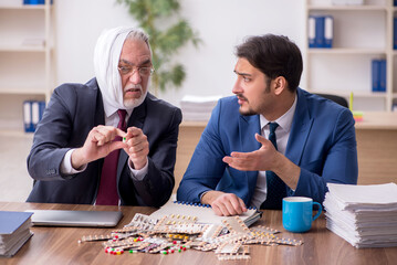 Fototapeta premium Old male employee suffering from toothache in the office