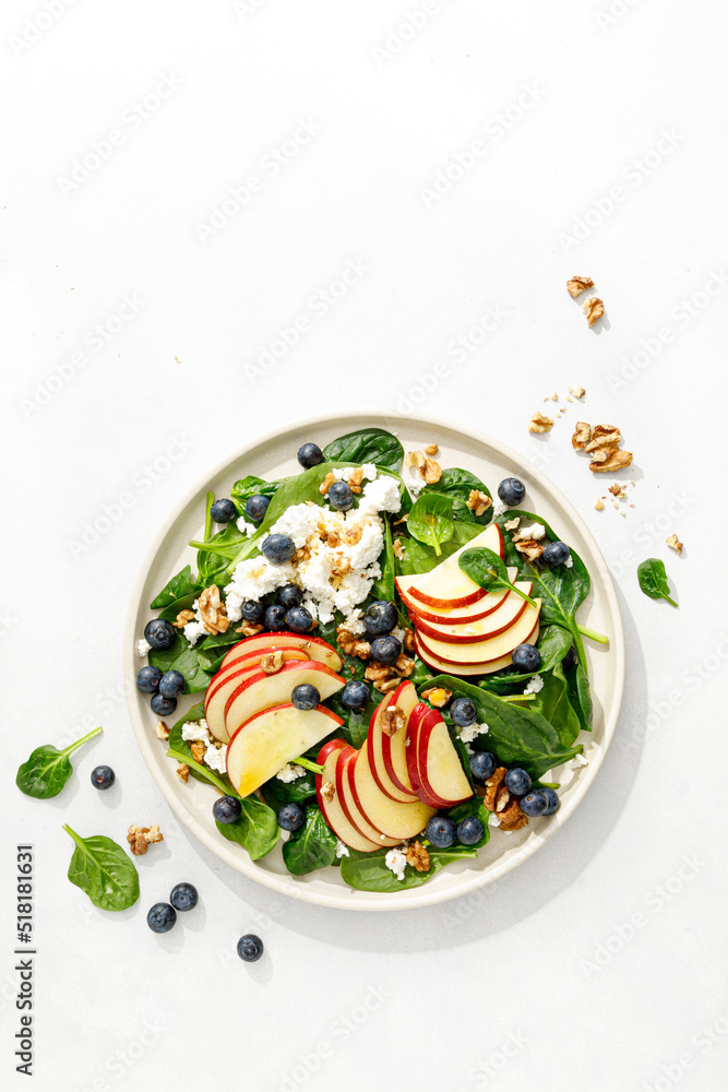 Canvas Prints Apple and spinach fresh sweet fruit salad with blueberry, cheese cottage and walnuts, top view