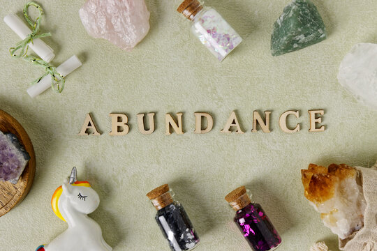 Abundance Word Wooden Letters With Magic And Happy Objects, Crystal Stones.