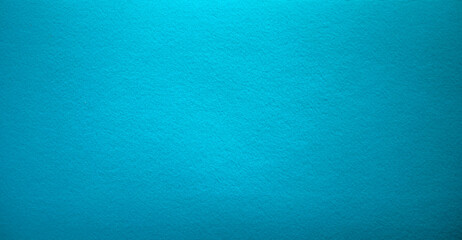 Photo of the turquoise background texture. Soft felt fabric of the color of the sea wave. A clean...