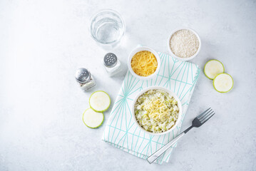 Obraz na płótnie Canvas Zucchini cheese rice in a bowl