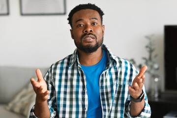 Serious Bearded African American Man Talking Communicating Sitting At Home