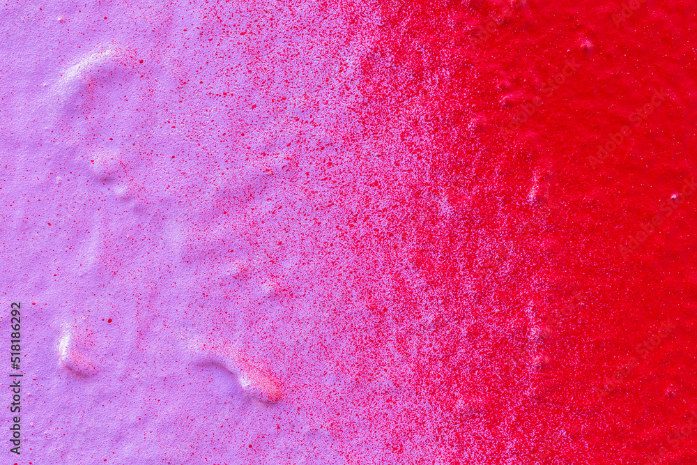 Poster macro close-up of a spray painted pink and red wall with splashes. abstract full frame textured spla