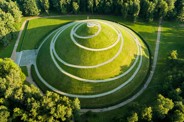 Aerial view of the famous Pilsudski's Mound in a sunny summer day, an artificial mound located in the western part of Krakow, on the Sowiniec Heights. - obrazy, fototapety, plakaty
