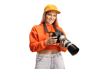 Young trendy female holding a professional camera