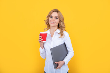 happy blonde woman with coffee cup and pc on yellow background