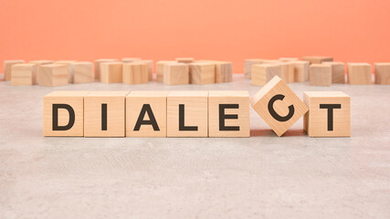 Dialect word written on wood block - text on wooden table for your desing, concept.