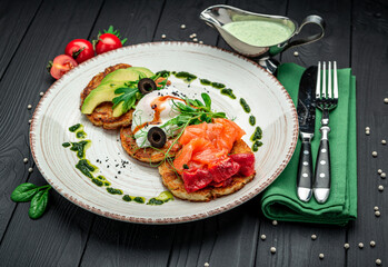 Potatoes pancakes, Hash brown. Hashbrown with feta cheese, salted salmon and chopped avocado.