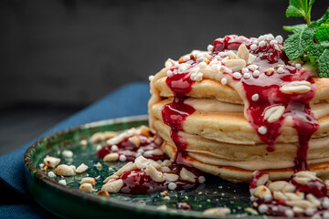 Pancake tower with yogurt, nuts and cherry jam