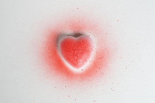 spray painted red heart on white background
