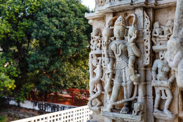 Fototapeta na wymiar Exterior of the Jain temple Adinatha temple with scenes from the Kamasutra, a Jain temple in Ranakpur, Rajasthan, India, Asia