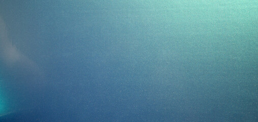 Photo of the texture of chameleon-colored vinyl film.  Rectangular background the color of the sea breeze.