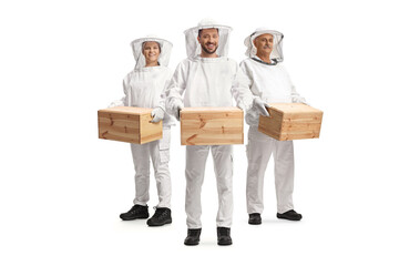Male and female bee keepers in uniforms holding wooden boxes