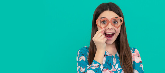Make it fun. Funny child wear heart-shaped glasses. Surprised girl. Valentines day fun. Funny teenager child on party, poster banner header with copy space.