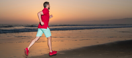 Man running and jumping, banner with copy space. sportsman sprinter running on sunrise summer beach...