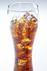 cola with ice cubes on white