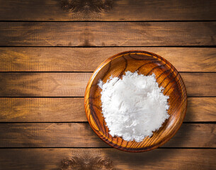 Baking soda in the wooden bowl - Healthy food