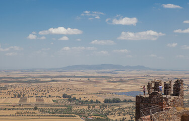 Visitors observing La Serena landscape, Magacela fostress, Spain