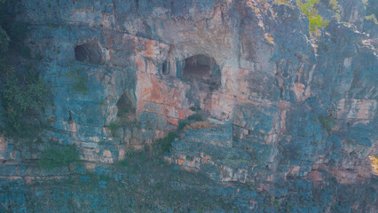 Ujevarat e Mirushes waterfall in central Kosovo, a set of beautiful cascade waterfalls and gorge behind it. Morning drone view of the caves in the mountain gorge.