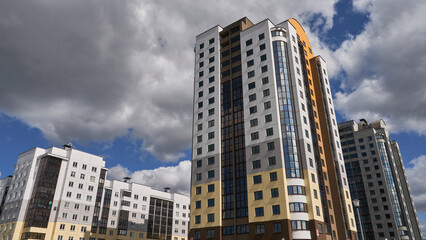 Fototapeta premium Beautiful modern multi-storey building in a new area of the city. A place to live and do business in Europe.