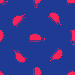 Red Hedgehog icon isolated seamless pattern on blue background. Animal symbol. Vector