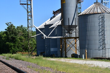 Fototapeta na wymiar Grain Elevator by Railroad Tracks