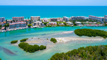 Little Hickory Island in Bonita Springs, Florida. Mangroves on the Bay with Low Tide in the Foreground and a beach on the Gulf of Mexico in the Background