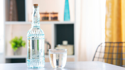  Glass of pure water on kitchen table