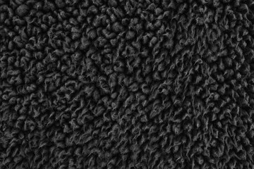 Faux fur black wool abstract pattern nature skin soft warm fluffy background dark artifical texture