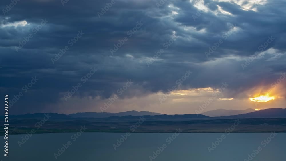 Canvas Prints timelapse of sunset and rainstorm moving in towards utah lake as dark clouds roll through the sky.