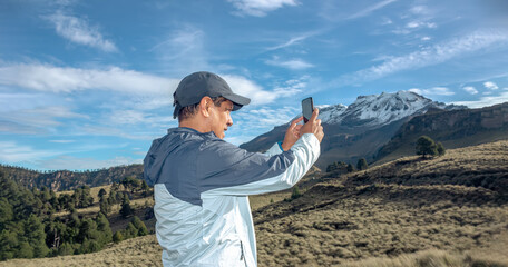 man taking a selfie on the snowy mountain