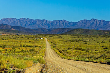 Dirt road in Little Karoo with Swartberg Mountains