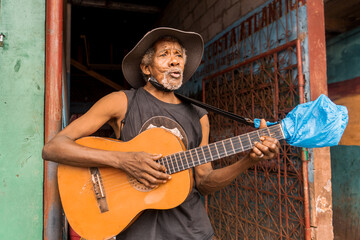 Native African American singer from Bluefields Nicaragua playing guitar and singing