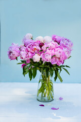 Bouquet of pink peonies on a light background. Vintage style
