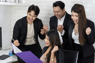 Yes! Businesspeople triumphing because of the financial growth of company. Happy smiling businesspeople triumphing with raised fists.