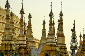 Gold tops on stupas at a Buddhist temple in Yangon, Burma