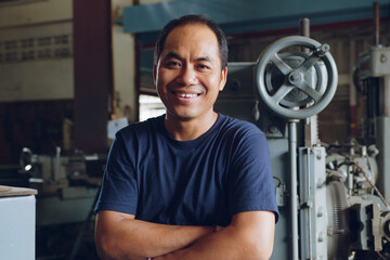 Portrait of technician Asian worker smiling in workshop factory