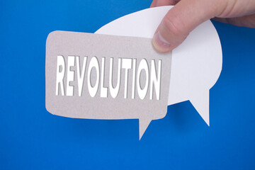 Speech bubble in front of colored background with Revolution text.