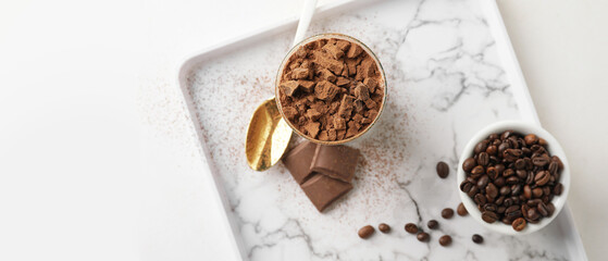 Sweet tasty tiramisu on light background with space for text