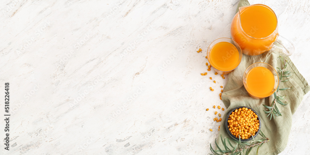 Canvas Prints healthy sea buckthorn juice on light background with space for text