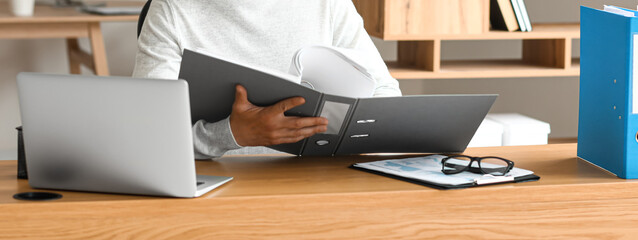 Man working with documents in office