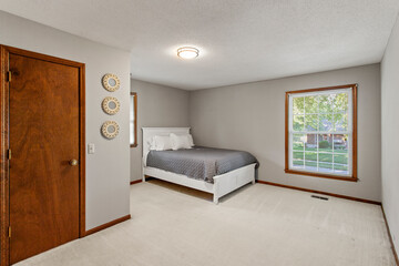 Modern Efficiency: Short-Term Rental with White Cabinets, Wood Floors, and Open Floor Plan