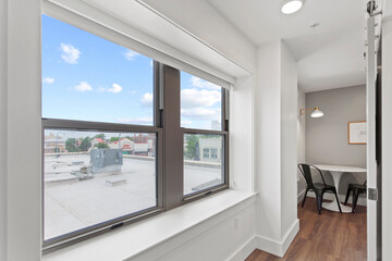 Modern Efficiency: Short-Term Rental with White Cabinets, Wood Floors, and Open Floor Plan