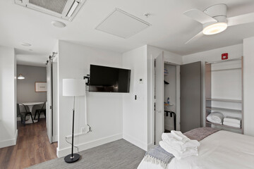 Modern Efficiency: Short-Term Rental with White Cabinets, Wood Floors, and Open Floor Plan