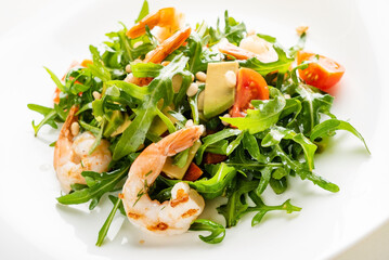 salad with shrimps, rocket salad and cherry tomatoes