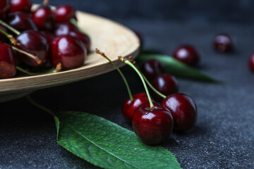 Tasty cherries on dark background, closeup