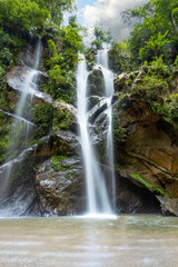 Beautiful waterfall in rain forest. Mok Fa Waterfell Changmai Thailand.