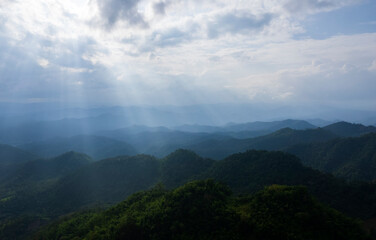 colorful dramatic sky with cloud at sunset. morning fog in dense tropical rainforest