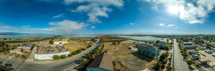 Aerial panorama view of Alviso district in San Jose California with rundown buildings colorful...